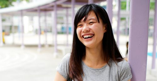Family life in Hong Kong.  Images include: Family at ocean, laughing together, reading, praying, playing games etc.