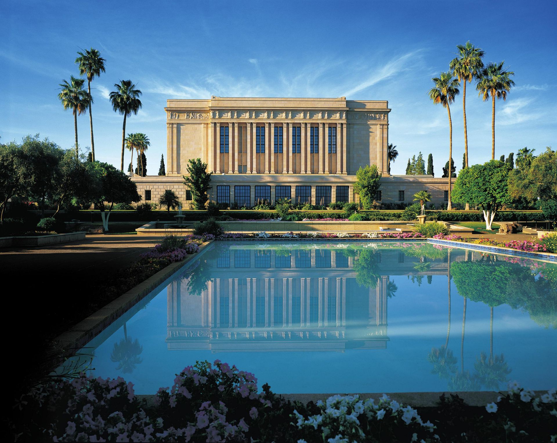 The Mesa Arizona Temple and its reflecting pool on a sunny day.
