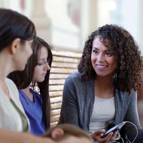 three women visiting together