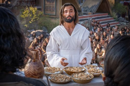 Jesus Christ blesses the sacrament bread and instructs the Nephites to eat.