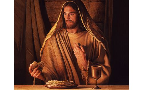 Jesus Christ holding a piece of bread