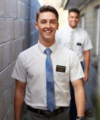 A missionary models appropriate dress and attire. He is wearing an approved shirt, tie, and pants.