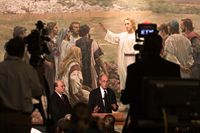 Henry B. Eyring and Quentin L. Cook at a podium during a press conference.