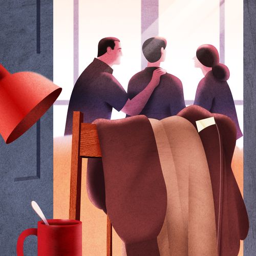 coat hanging over chair, with family in background