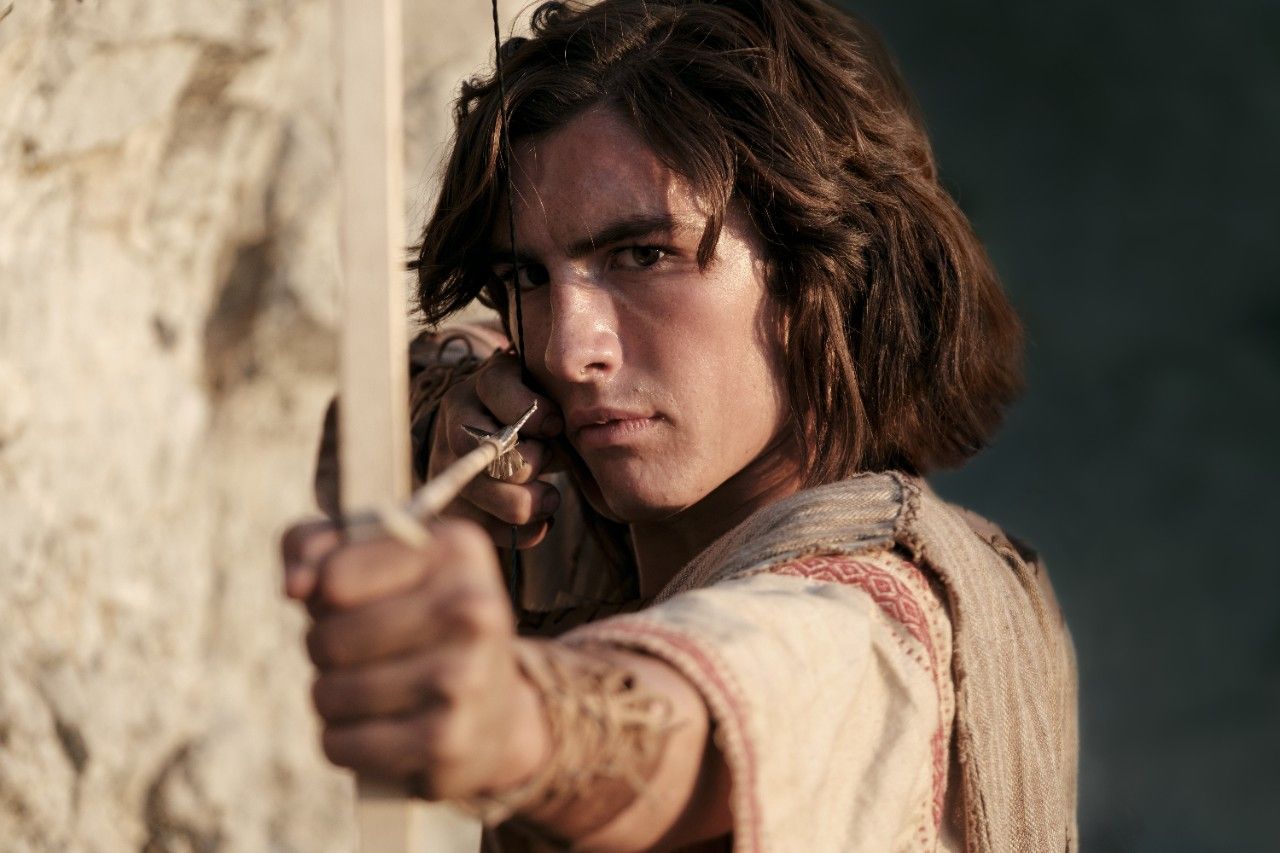 Nephi draws his new bow as he hunts in the wilderness.