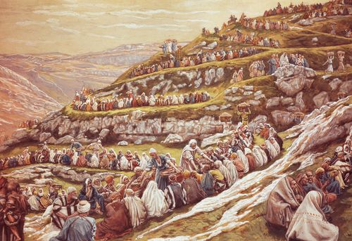 Jesus Christ standing on a terraced hillside with a large multitude of people. Christ is blessing a few loaves of bread and fishes. He is feeding the multitude. The disciples are passing the food among the people. (Matthew 14:13-2, Mark 6:31-44, Luke 9:10-17, John 6:1-13)