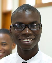 A missionary elder smiles as his picture is taken. He is with other missionaries at the Missionary Training Center in Ghana.