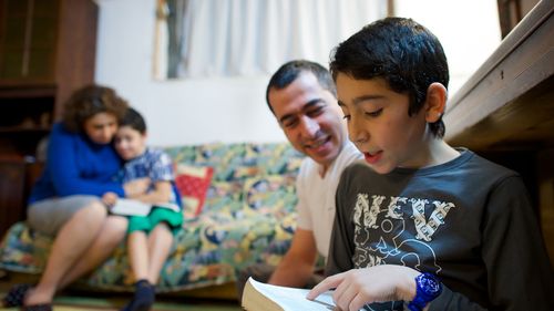 family reading scriptures together