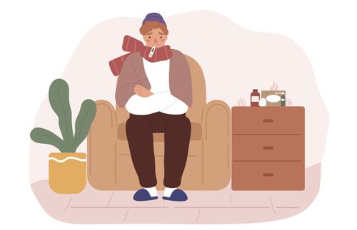 a sick man sitting on the couch