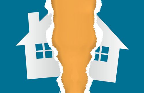 a house appearing in a picture that is torn in half