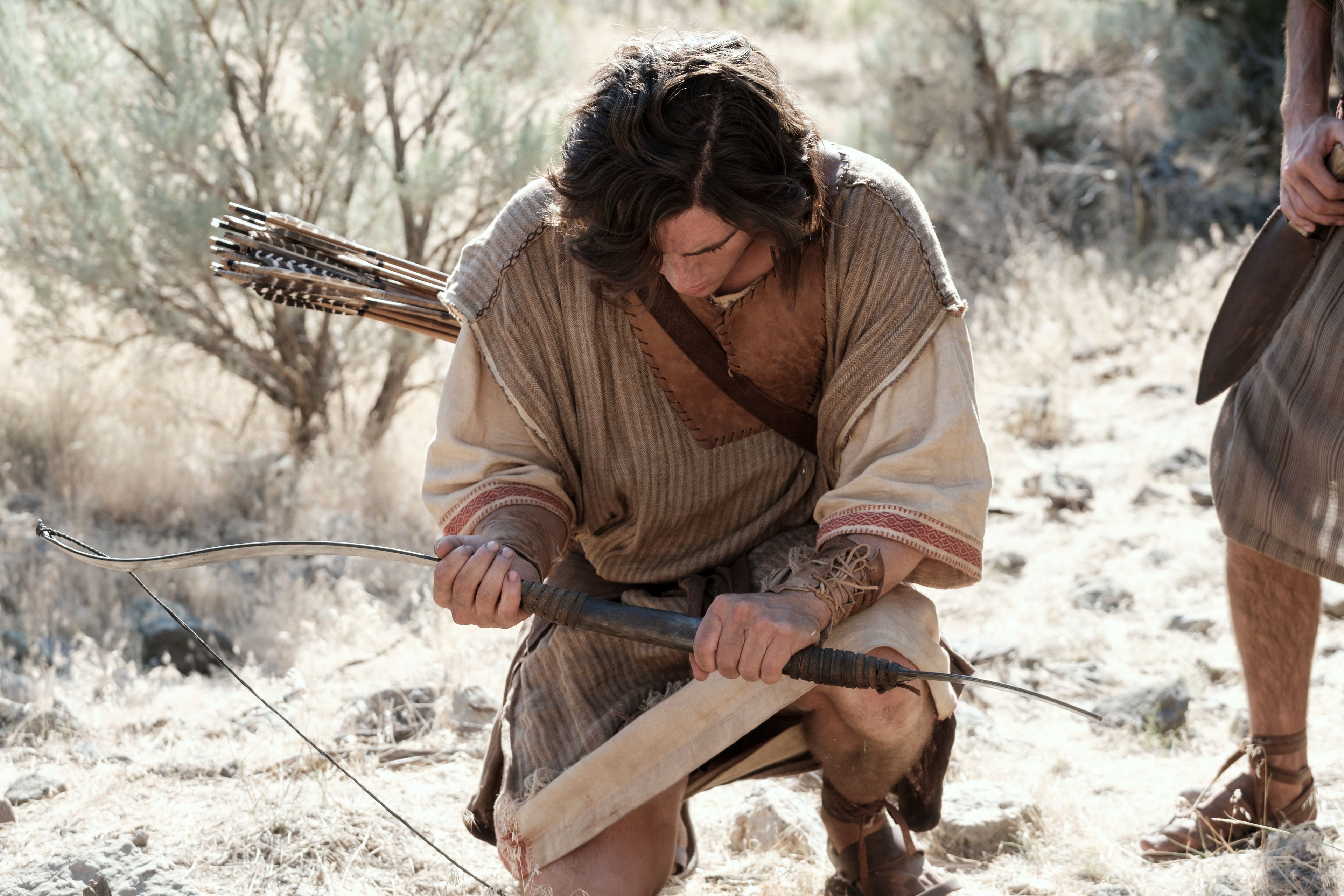 Nephi breaks his bow in the wilderness.