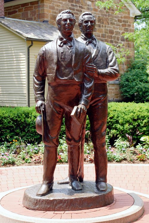 A metal statue of brothers Hyrum and Joseph Smith stands in Carthage, Illinois, near Carthage Jail.