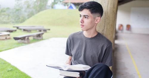 Young Man reading scriptures