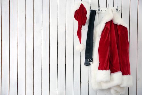 Santa costume hanging on wall