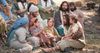 Jésus assis avec des enfants
