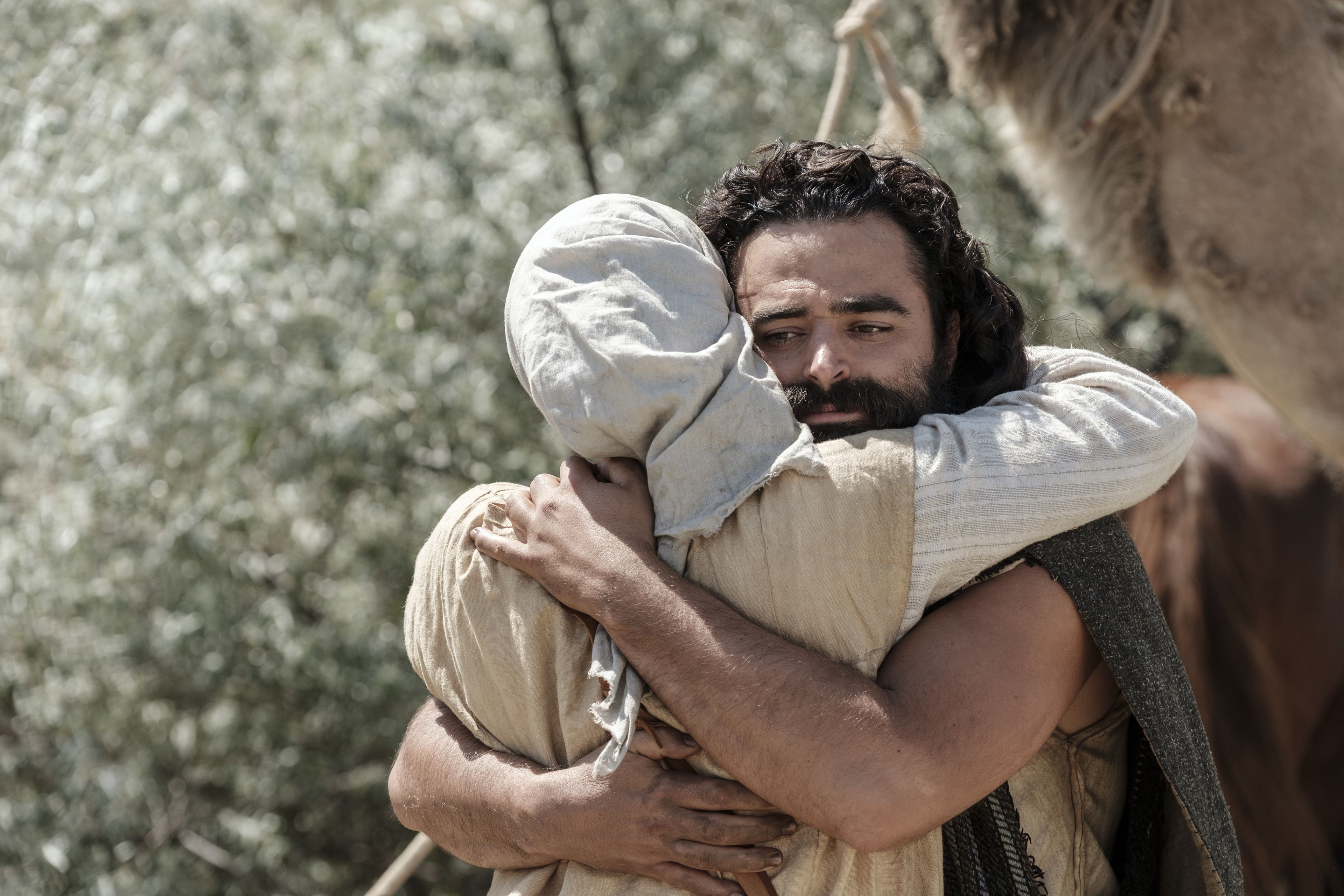 Sariah hugs Laman upon his return to the camp.