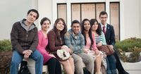 A group of young men and young women sit together during an EFY event in Chile.