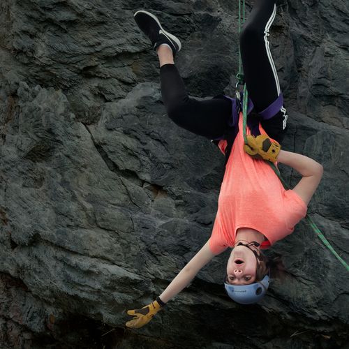 young woman rock climbing