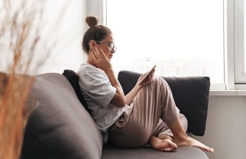 woman sitting on the couch