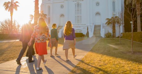 A group of youth walking towards the St. George Utah Temple.