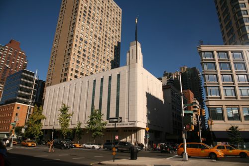 A distant view of the front entrance to the Manhattan New York Temple and surrounding scenery.