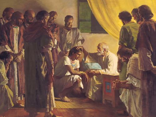 Jacob laying his hand on his son’s head to bless him