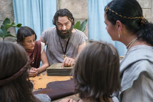 King Benjamin gathers with his family around a table in the Land of Zarahemla and tells them he can no longer be king.