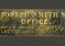 1 sign from Joseph Smith's office, sign has black background with gold lettering that reads "Joseph Smith's Office President of the Church of Jesus Christ of Latter Day Saints."  In a black frame with glass over the sign.
