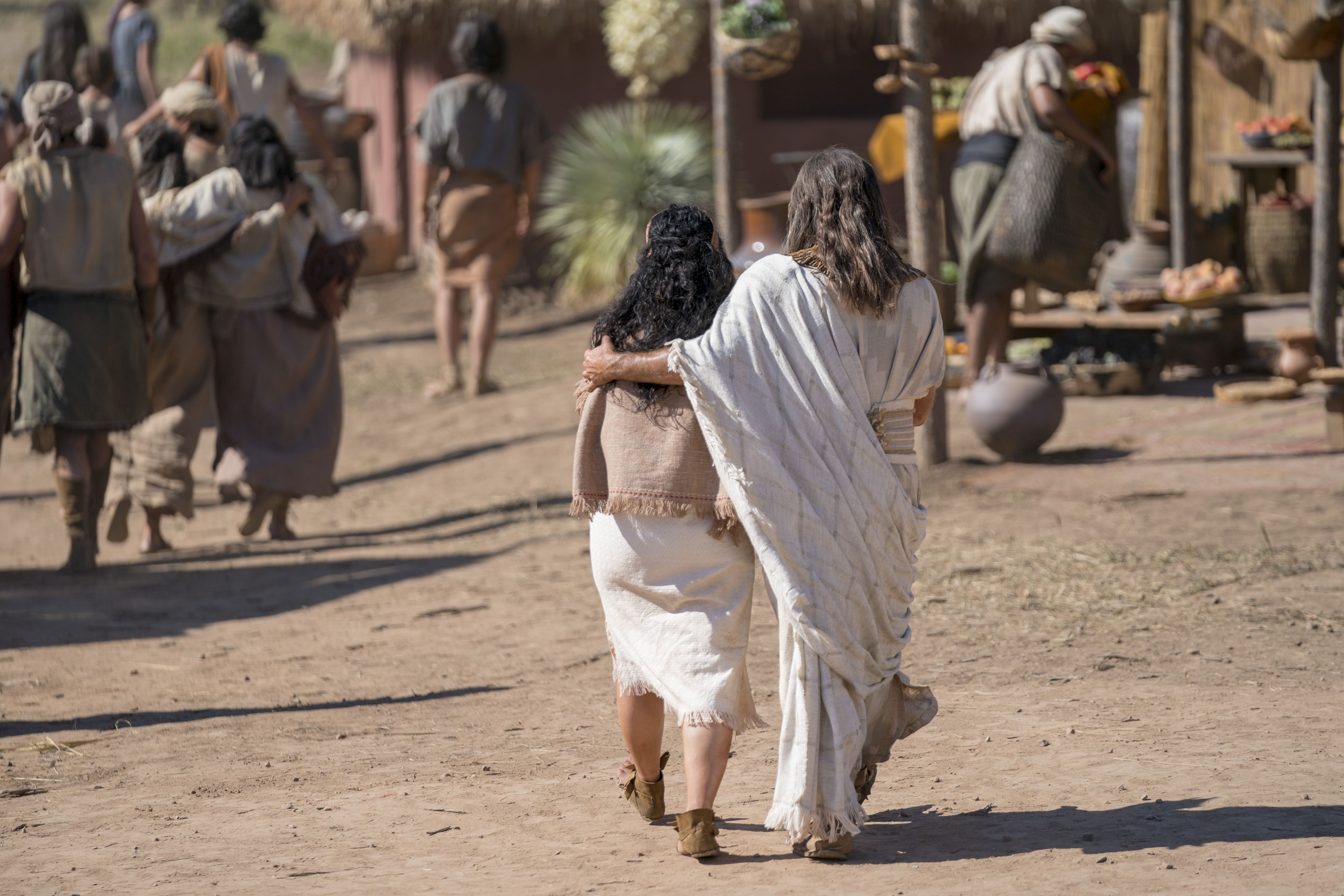 Jacob walks with his arm around his wife after teaching the Nephites.