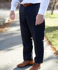 A senior missionary models appropriate dress and attire. He is wearing an approved shirt, tie, and pants.