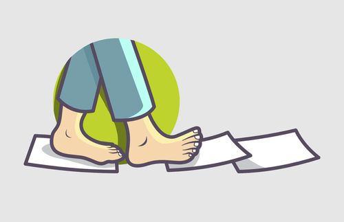 feet walking on pieces of paper