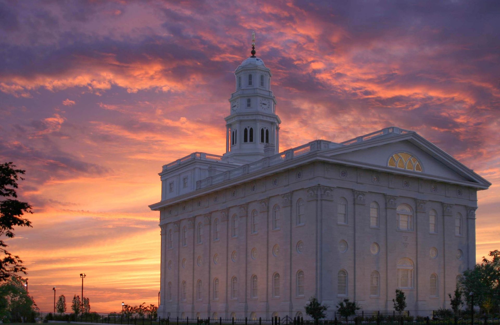 The Nauvoo Illinois Temple back view at sunset, including scenery.