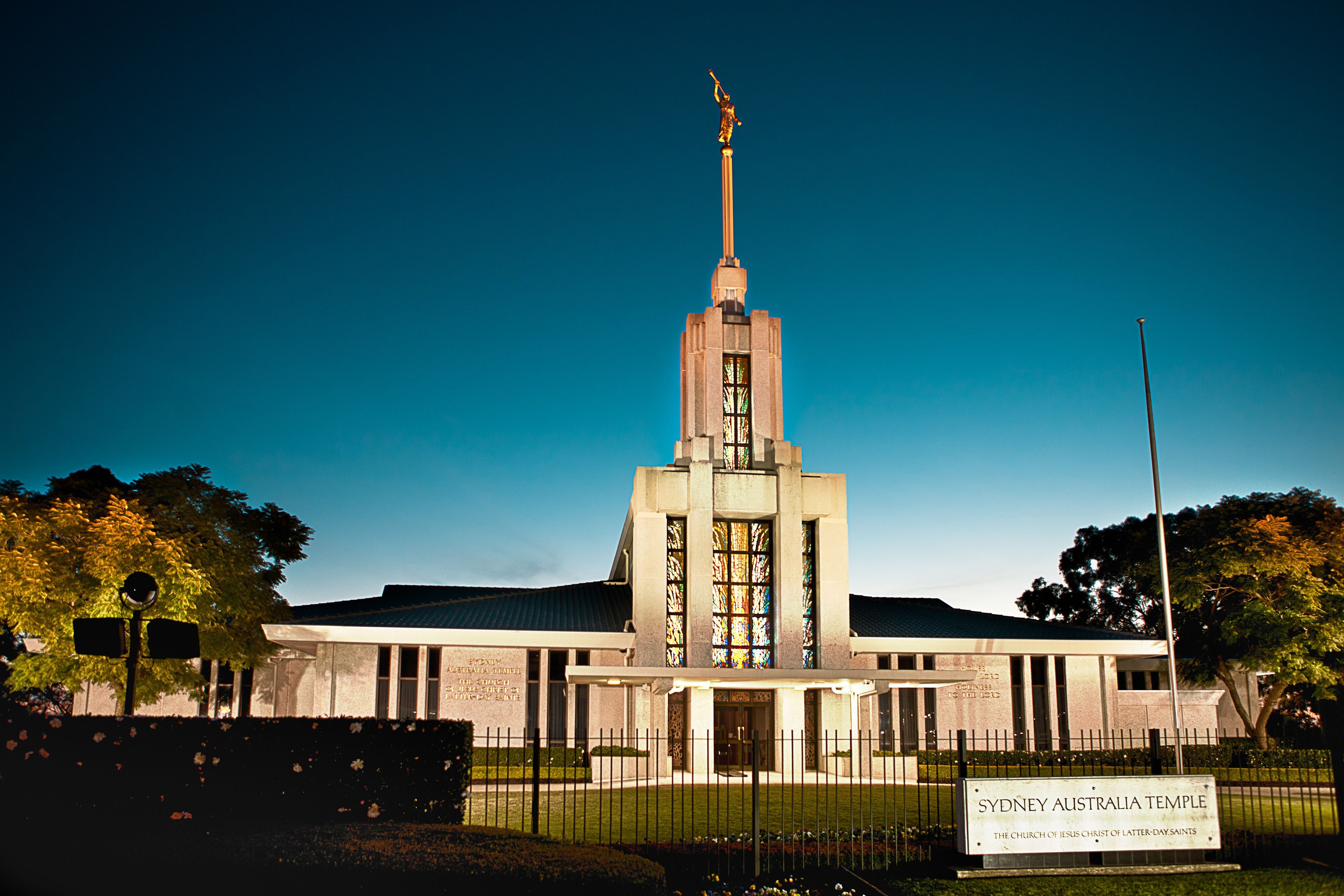 The Sydney Australia Temple and its entrance in the evening.