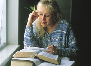 Woman studying scriptures