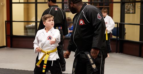 boy learning tae kwon do
