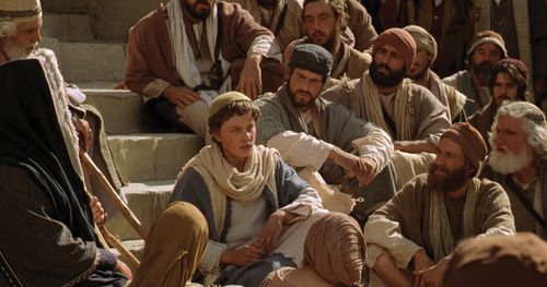 The young Jesus teaches in the temple.