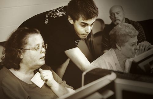 young man helping woman