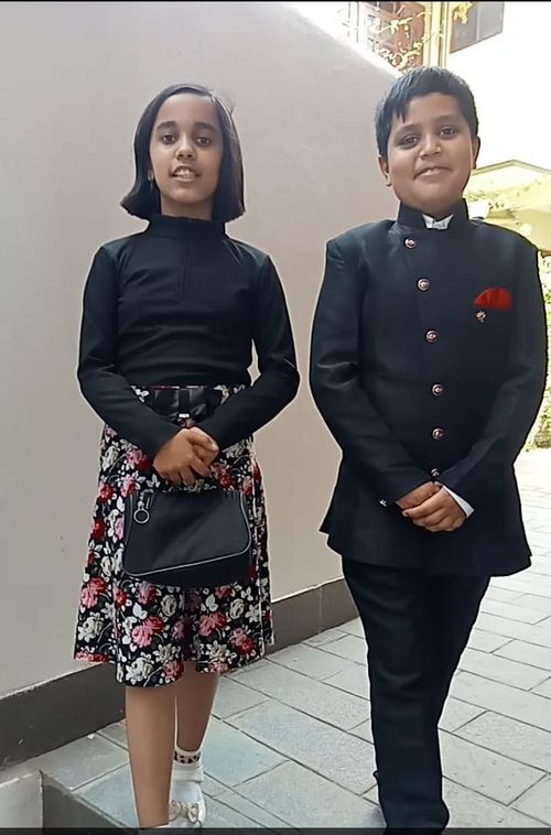 Angel and Aaron Adhikari take a picture together.