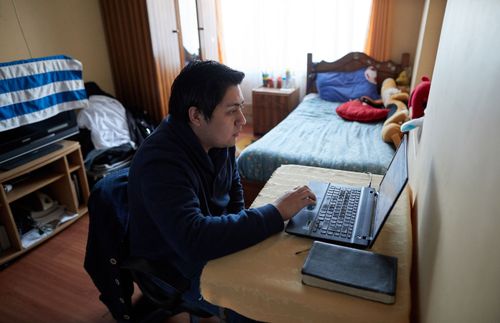 a man looking at a computer