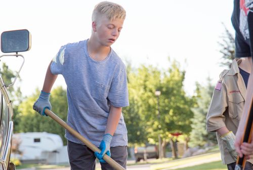 young man doing yard work