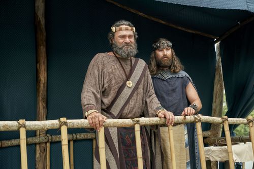 King Benjamin and Mosiah stand together on a tower as King Benjamin speaks to the Nephites in the Land of Zarahemla.