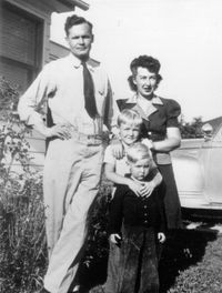 Family portrait of the Jeffrey R. Holland family (young Jeffrey shown in front of his brother) circa 1944.