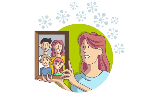 woman holding up a family picture