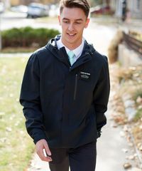 A missionary models appropriate dress and attire. He is wearing an approved jacket and pants.