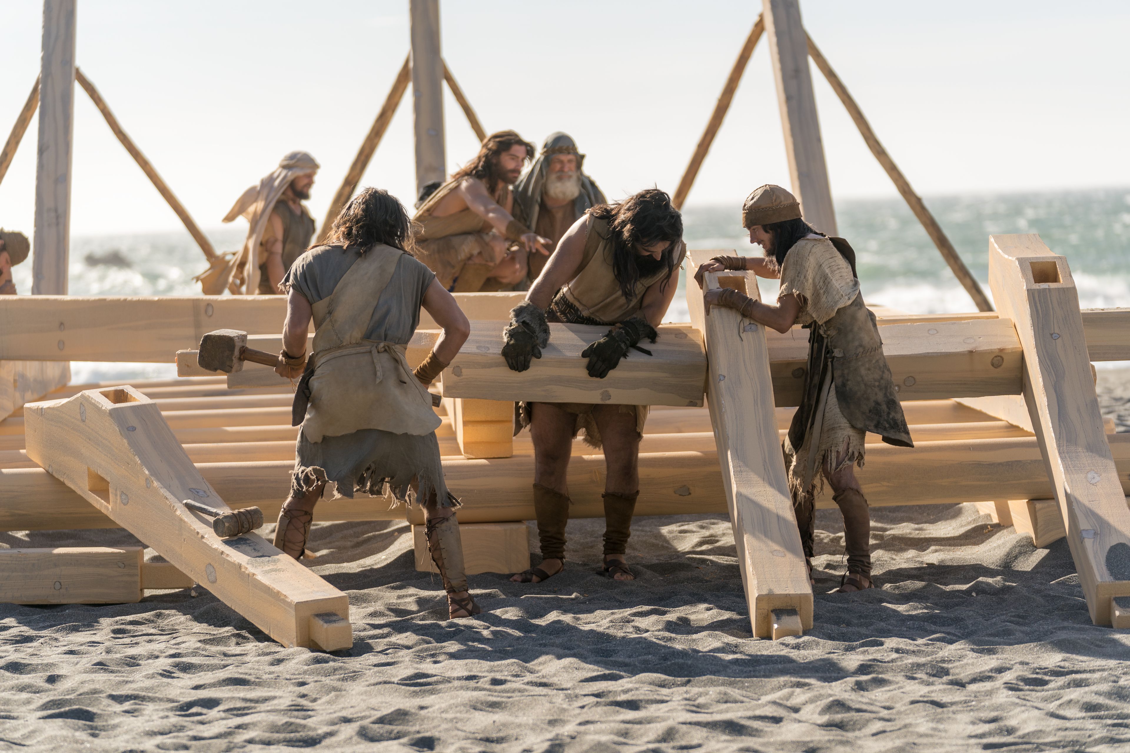 Nephi and his brothers build the ship.