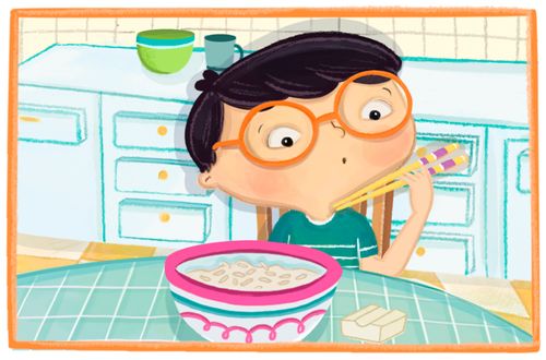 boy looks at his chopsticks