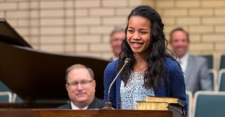 young woman speaking in sacrament meeting