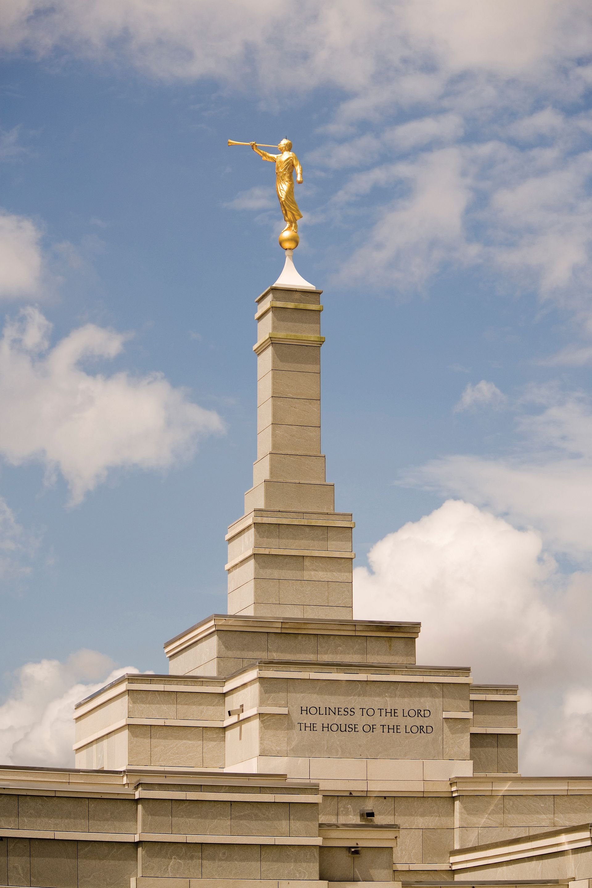 The statue of the angel Moroni stands on top of the spire of the temple.