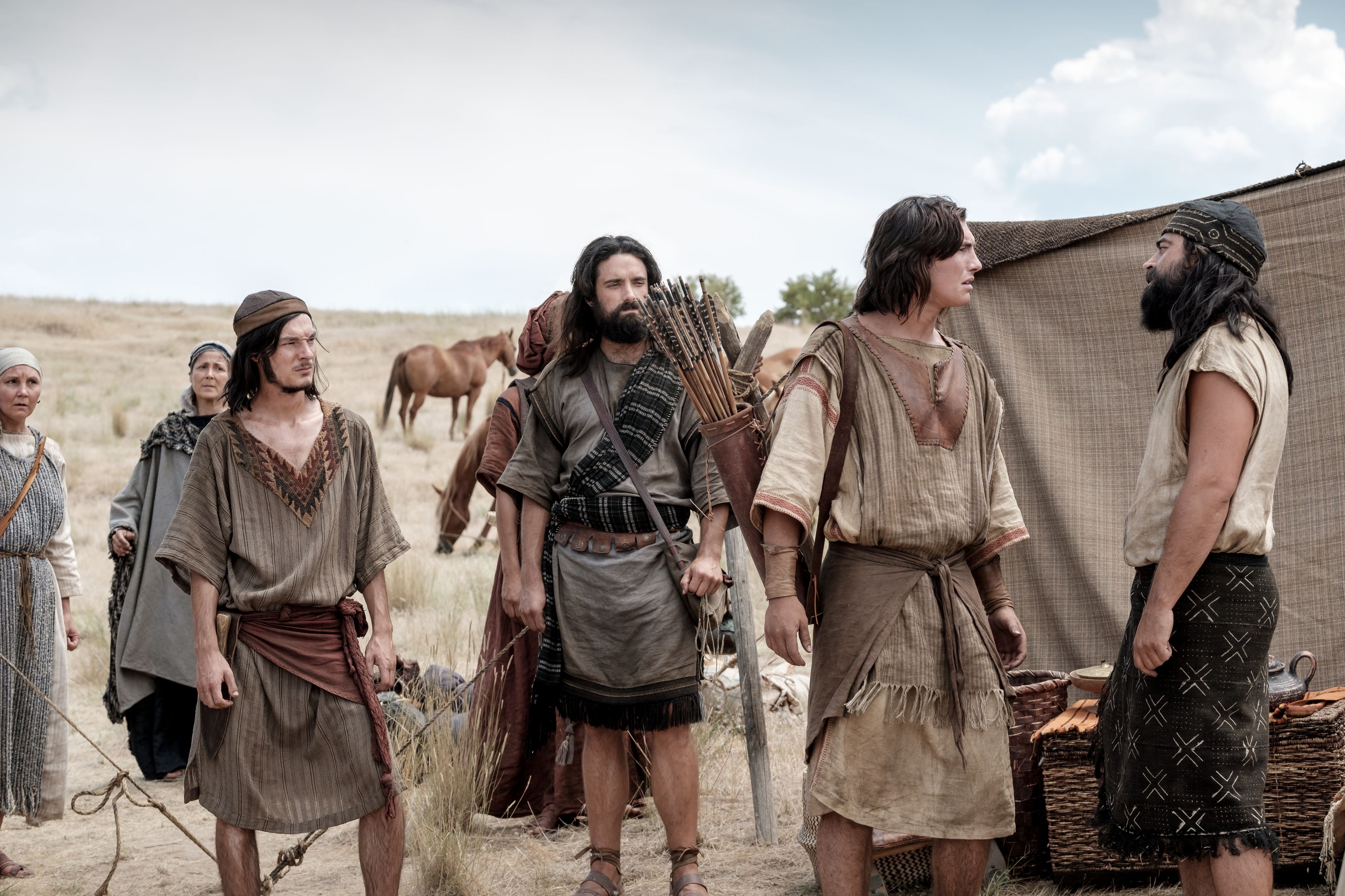 Nephi and his brothers argue in camp in the wilderness.