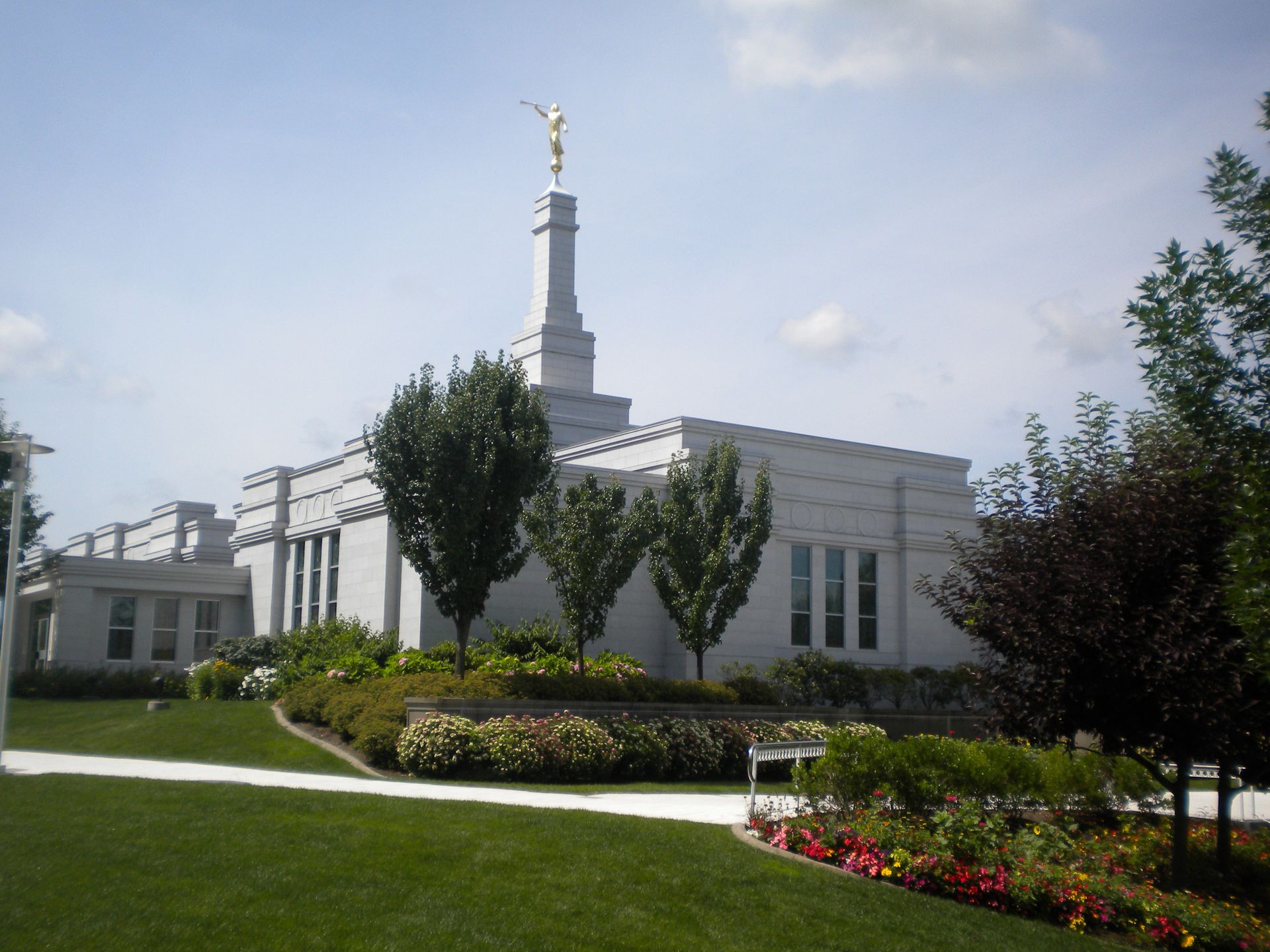 The Palmyra New York Temple and grounds on a sunny day.
